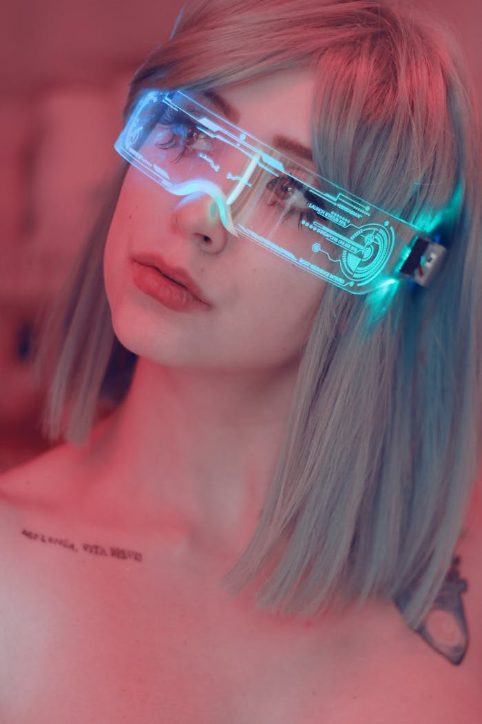 services-06 Portrait of a young woman wearing neon light glasses, conveying a futuristic and stylish vibe.